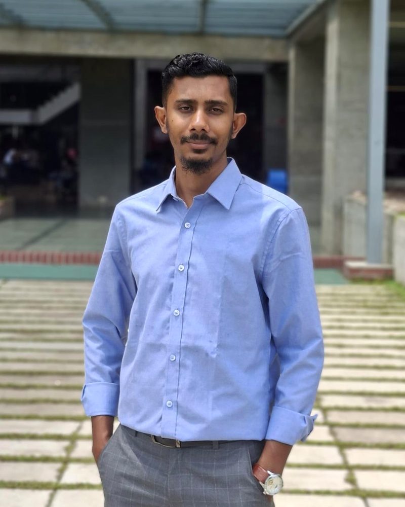 Syed Talha Islam, founder of Solustation, standing outside the university campus in Dhaka